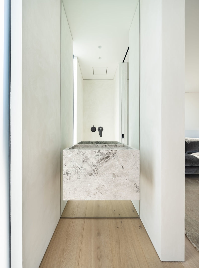 Modern Sink and Mirror next to limewash painted walls using lime wall paint 102