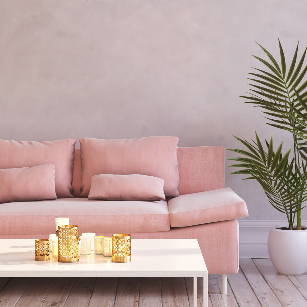 Pink couch in front of a Luminescent and Radiant Lime Wash Paint 150